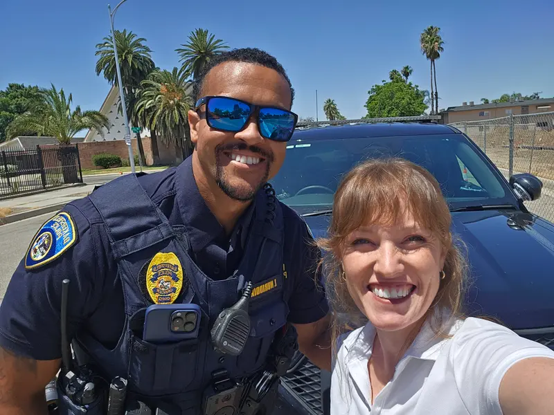 Kathryn Halling with a Bakersfield police officer during a ride-along